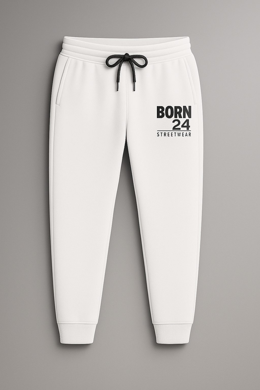 White sweatpants with 'BORN 24 STREETWEAR' text on a gray background